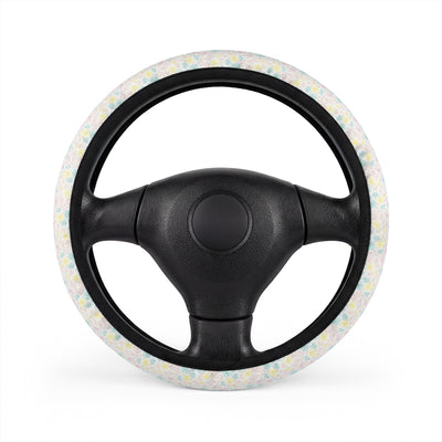 White pastel floral steering wheel cover, on a steering wheel