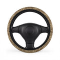 Beige brown giraffe print steering wheel cover, on a steering wheel