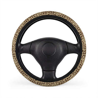 Beige brown giraffe print steering wheel cover, on a steering wheel