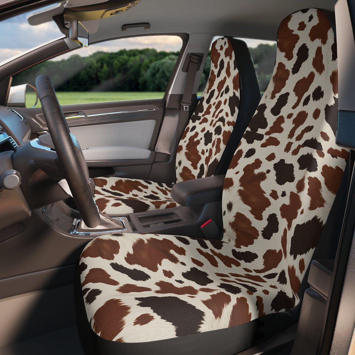 Black brown cow print car seat covers, fitted on the front seats of a car