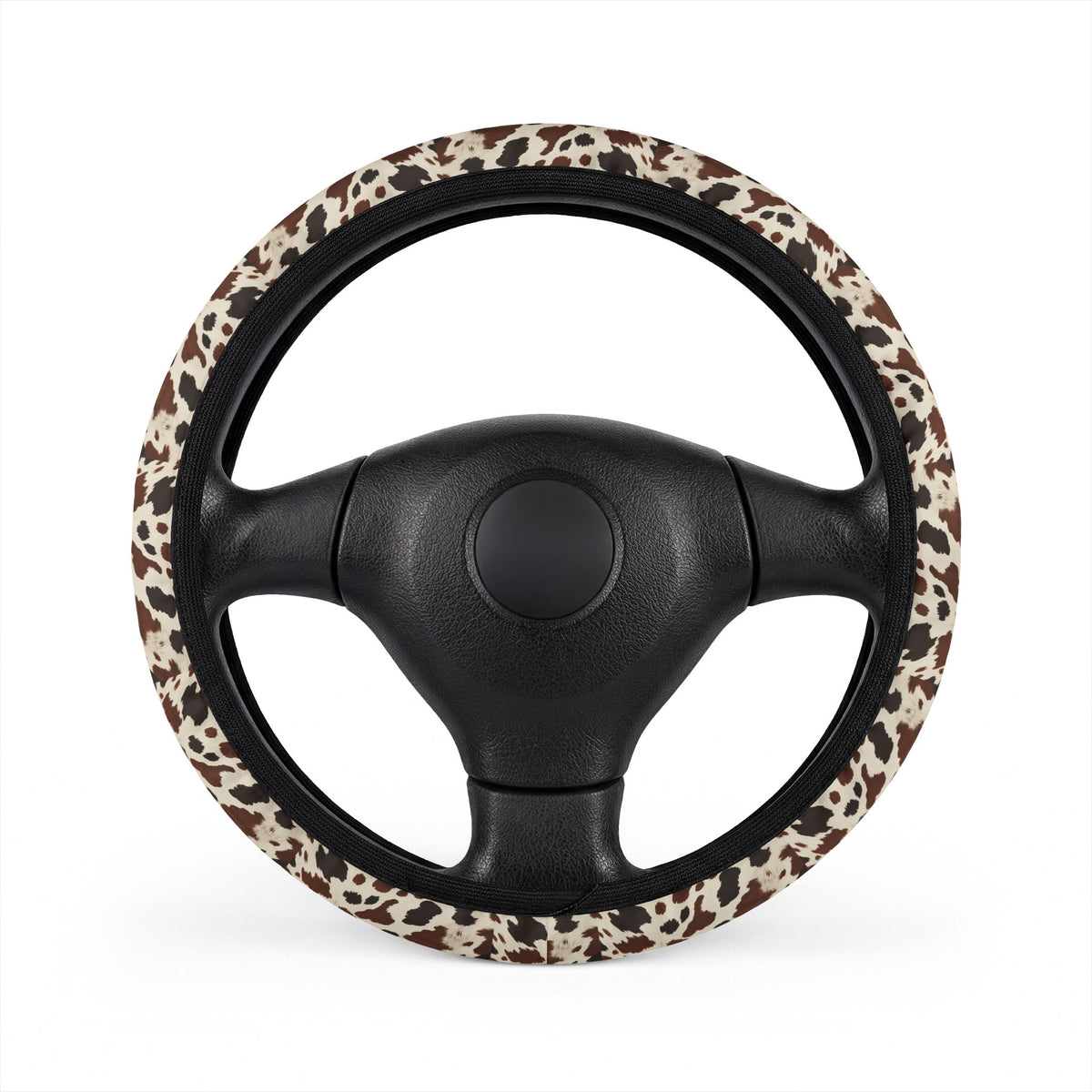Black brown cow print steering wheel cover, on a steering wheel