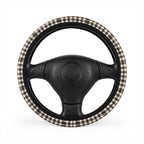 Black brown houndstooth steering wheel cover, on a steering wheel