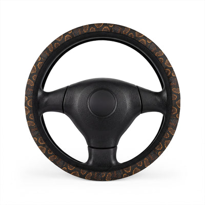 Black brown snake print steering wheel cover, on a steering wheel