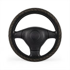 Black gold plaid steering wheel cover, on a steering wheel