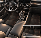 Black leather look car mats shown in a car interior