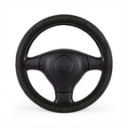 Black leather look steering wheel cover, on a steering wheel