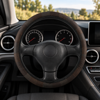 Black leather look steering wheel cover shown in a car interior