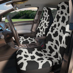 Black white cow print car seat covers, fitted on the front seats of a car