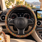 Brown floral steering wheel cover shown in a car interior