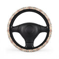 Cream pastel aztec steering wheel cover, on a steering wheel