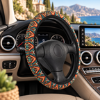 Dark aztec diamond steering wheel cover shown in a car interior