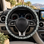 Gray camo steering wheel cover shown in a car interior