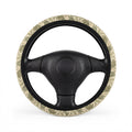Green dinosaur steering wheel cover, on a steering wheel