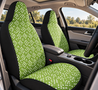 Green polka dot car seat covers shown in a car interior