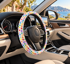 LGBTQ Pride Rainbow steering wheel cover shown in a car interior