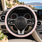 Light pastel aztec print steering wheel cover shown in a car interior