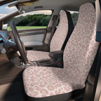 Light pink leopard print car seat covers, fitted on the front seats of a car