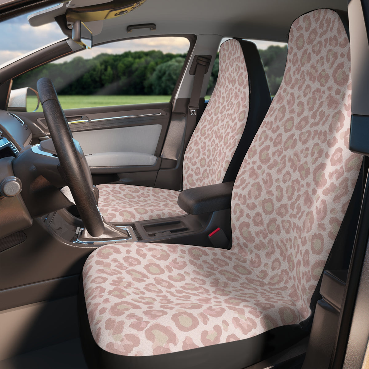 Light pink leopard print car seat covers, fitted on the front seats of a car