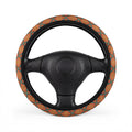 Orange floral steering wheel cover, on a steering wheel