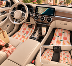 Peach fruit print car mats shown in a car interior