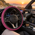 Pink black leopard print steering wheel cover shown in a car interior