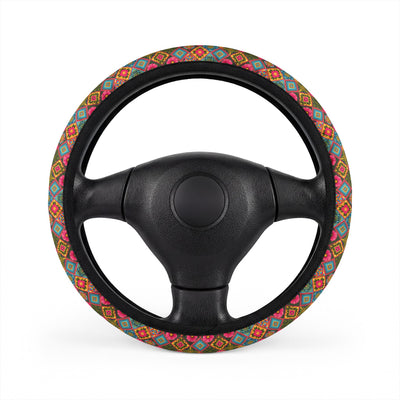 Pink floral steering wheel cover, on a steering wheel