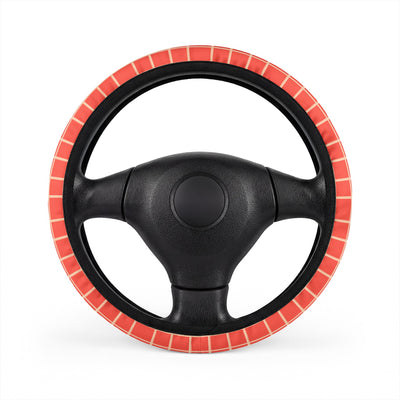 Pink gingham steering wheel cover, on a steering wheel
