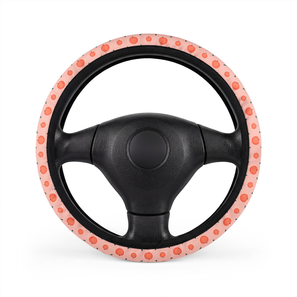 Pink peach print steering wheel cover, on a steering wheel