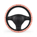 Pink peach print steering wheel cover, on a steering wheel