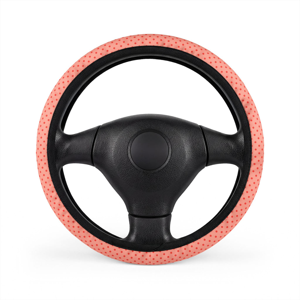 Pink polka dot steering wheel cover, on a steering wheel