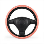 Pink polka dot steering wheel cover, on a steering wheel