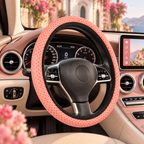 Pink polka dot steering wheel cover shown in a car interior