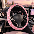 Pink unicorn steering wheel cover shown in a car interior