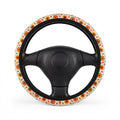 Retro orange flower print steering wheel cover, on a steering wheel