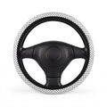 White big polka dot steering wheel cover, on a steering wheel
