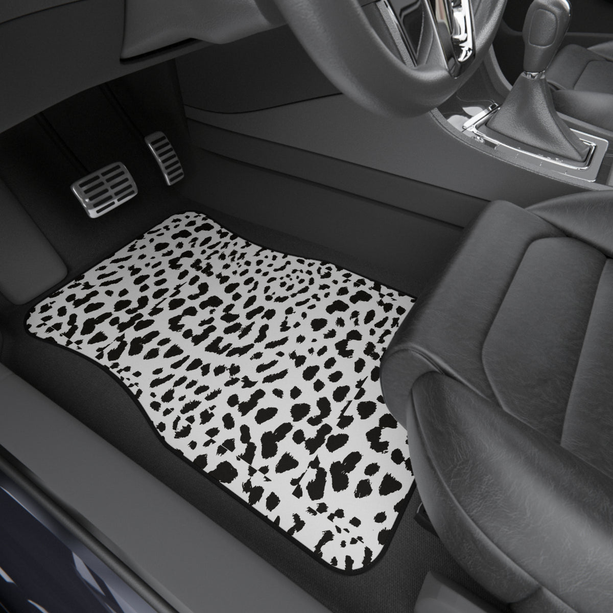 White leopard print car mats shown in a car interior