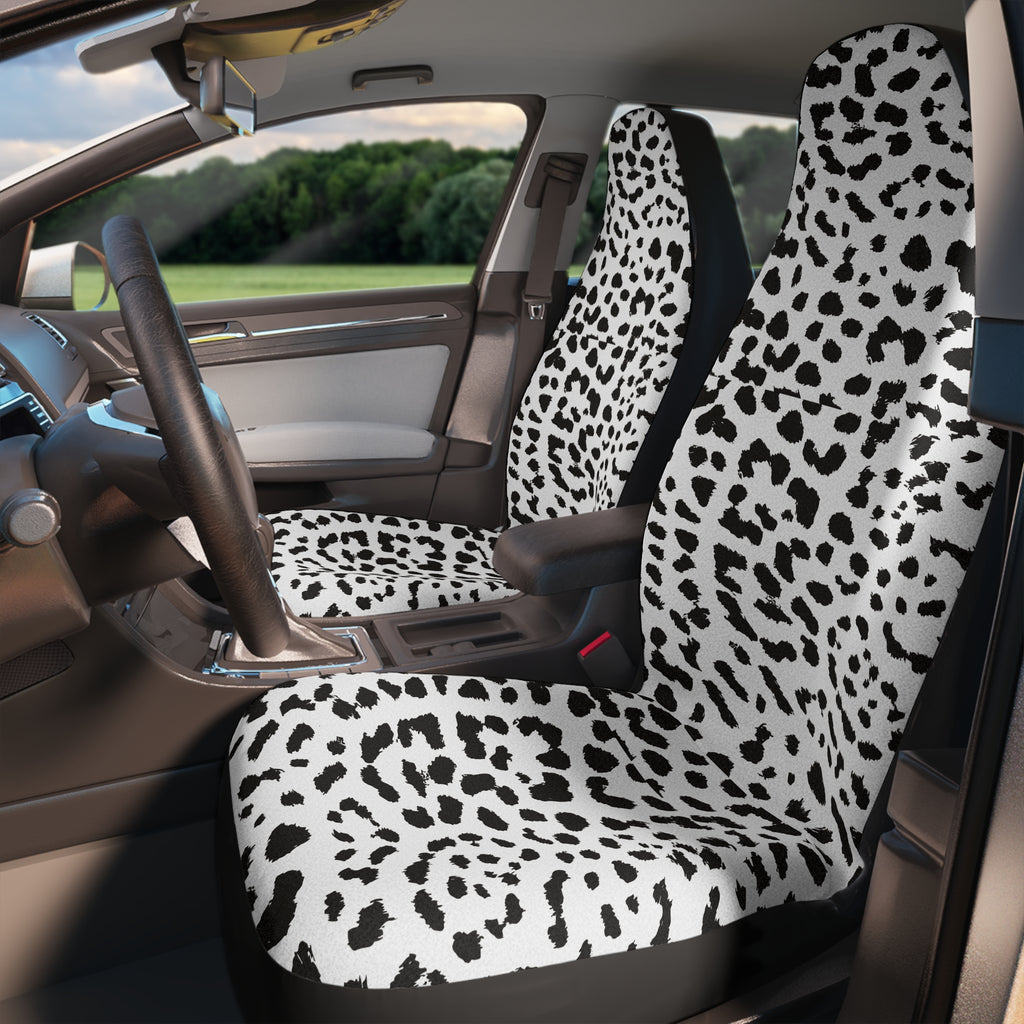 White leopard print car seat covers, fitted on the front seats of a car