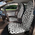 White leopard print car seat covers, fitted on the front seats of a car