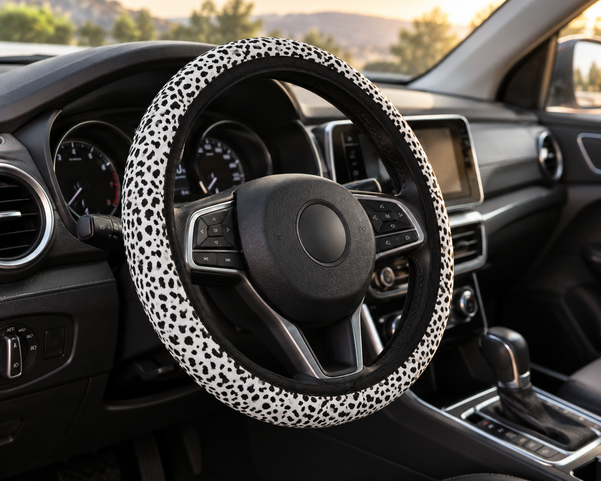 White leopard print steering wheel cover shown in a car interior