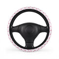 White pink unicorn steering wheel cover, on a steering wheel