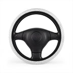 White polka dot steering wheel cover, on a steering wheel